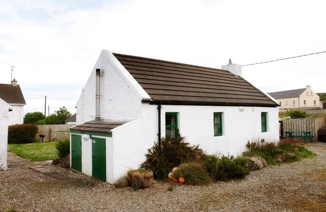 OPEN . Traditional, petite charming Irish country cottage.
