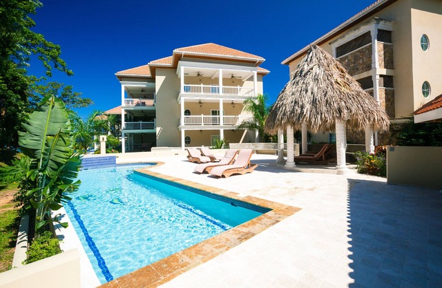 Out our door onto the sand and into the water, luxury condo and Large Patio in Lawson