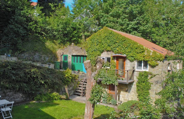 Pretty two storey holiday cottage right beside the village stream.