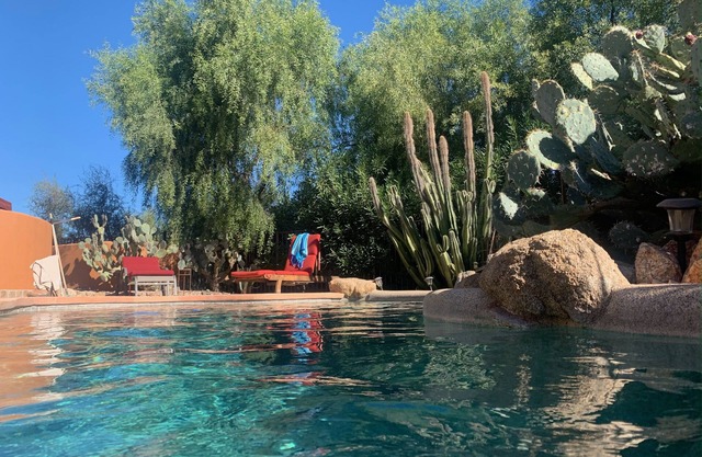 Private Desert Oasis with heated pool; spa; covered deck; spectacular views.