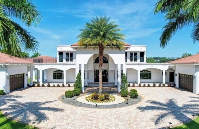 Private, gated 8-bedroom oasis with 6 car garage in prestigous Southwest Ranches