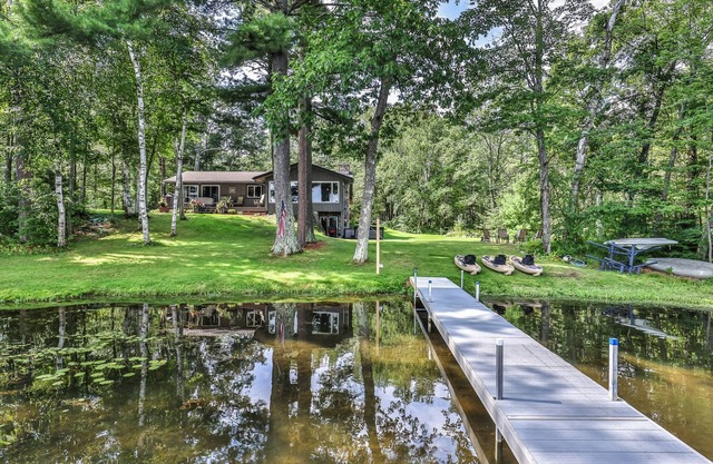 Private waterfront home with dock, kayaks, firepit, & open layout - dog-friendly