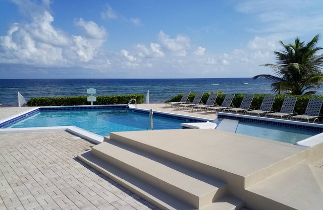 Relax in Cayman Casual style. Modern convenience in a quiet beachfront setting.