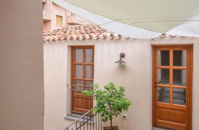 Relax in your cozy apartment in the heart of historic Oliena.