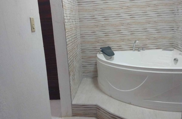 Relax & Recharge in Spanish Town – 2BR Oasis w/Hot Tub, AC & Wi-Fi