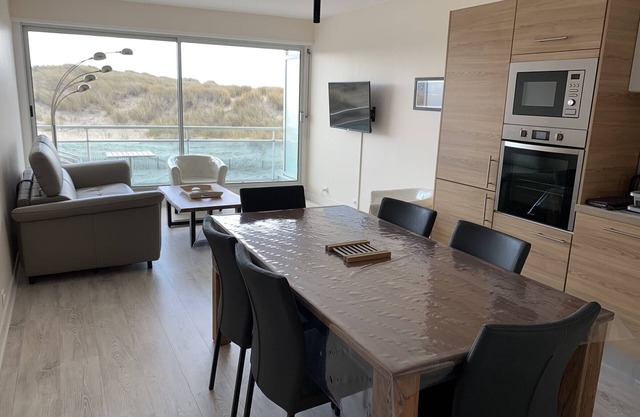 Renovated apartment with private garage, balcony, and sea view