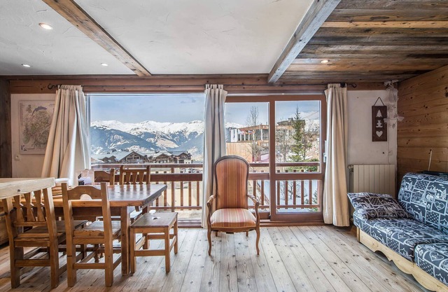 Renovated apartment with open kitchen, balcony, and direct slope access