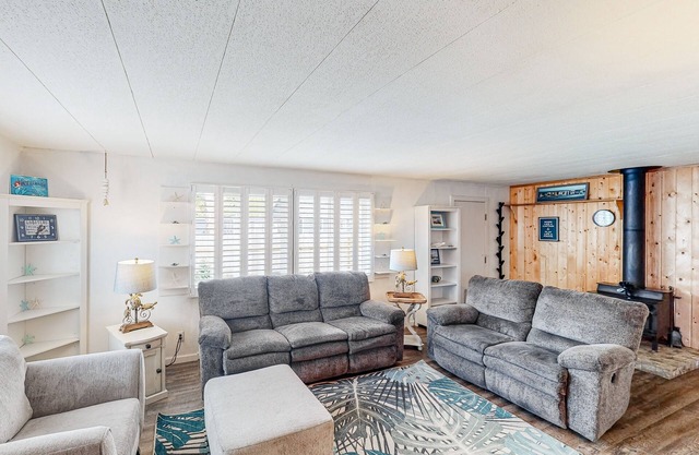 Retro-chic retreat near the beach with a fenced yard & deck, & washer/dryer