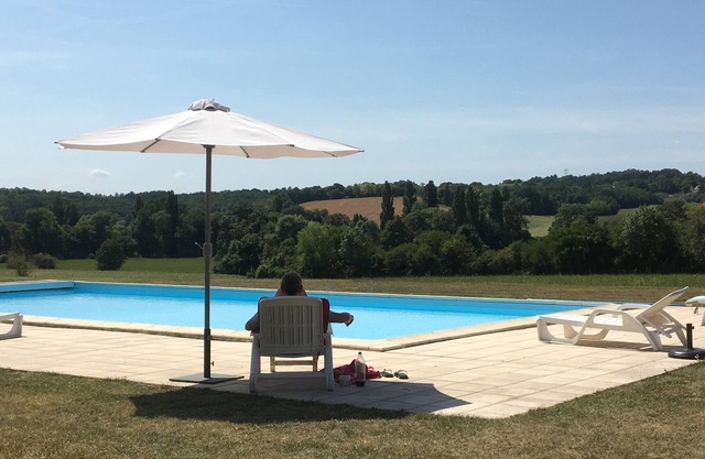 Rural converted farmhouse with heated pool and tennis court near popular village