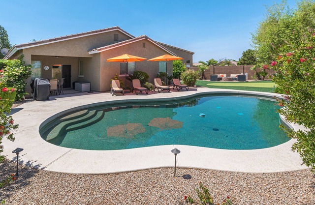 San Tan Valley Backyard Paradise with Heated Pool, Putting Green, and Fire Pit