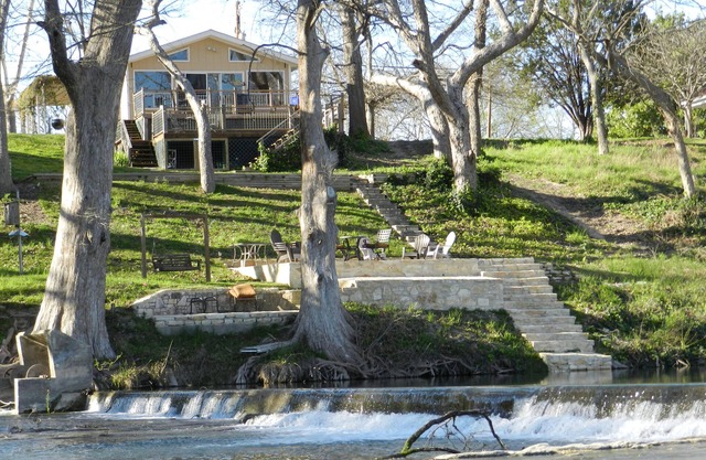Scenic riverfront home on quiet stretch of Guadalupe - waterfall by huge front porch