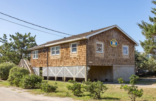 Semi-oceanfront dog-friendly home with private hot tub, decks & shared pool
