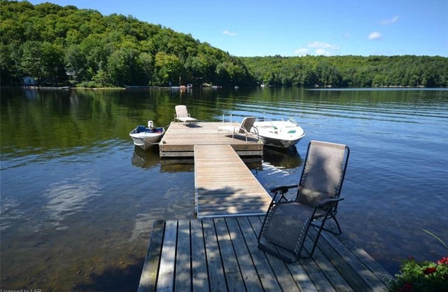 Serenity Now!nBeautiful Drag Lake. Beach, dock, hot tub and fire pit. Flat lot.