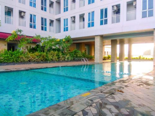 Simply Look Studio at Grand Dhika City Apartment By Travelio