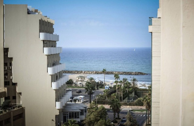 Skyline 1BR Apartment with City and Sea View