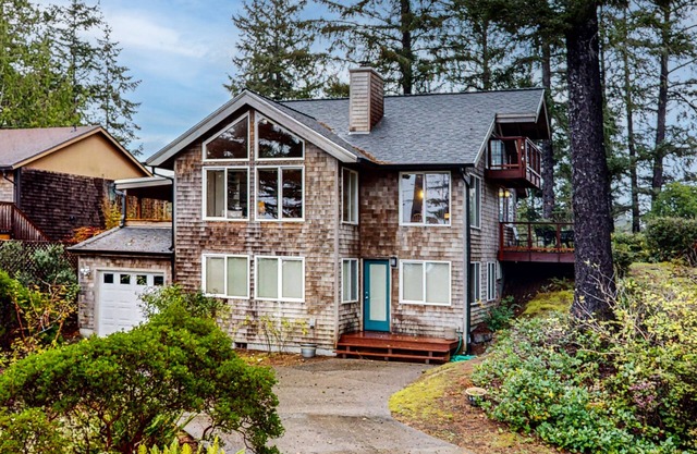 Spacious 3-story home near the beach with water views, grill, deck, & firepit