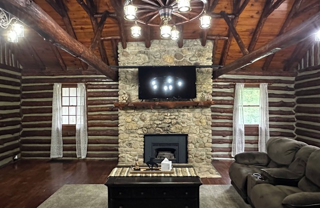Spacious 5-bedroom log cabin home with 2 ponds and 50 acres just outside Moberly