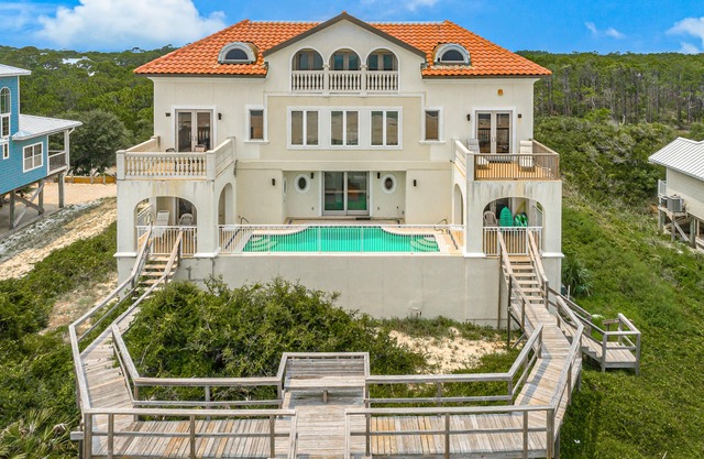 Spacious beachfront home with private pool, elevator, boardwalk & on-site pools