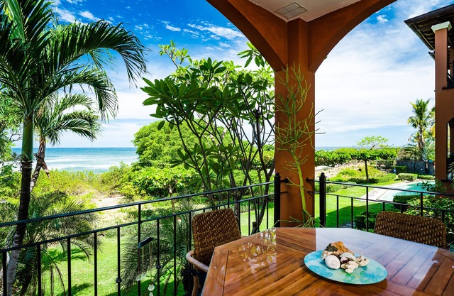 Spacious beachfront 2-BR condo with Pool and a stunning sunset view