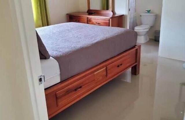 Spacious two bedroom home with ocean view, pool and tennis court.