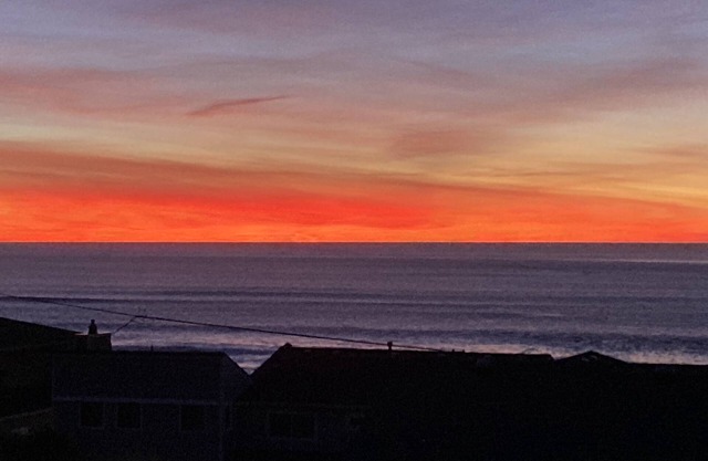 Spacious Roads End home with private hot tub, ocean views and two fireplaces.