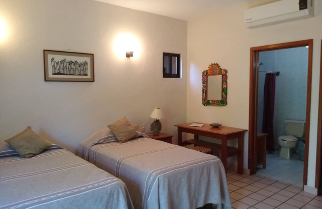 Spacious room in family guesthouse walking distance to La Ropa beach