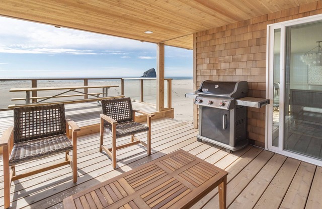 Spectacular Views from this Beachfront Home literally Steps to the Sand!