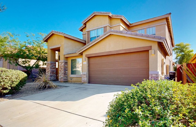 Sprawling home with an enclosed yard, open layout, fireplace, grill, & W/D