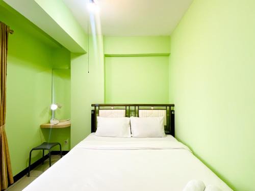 Stunning and Homey 2BR Pool View Green Bay Pluit Apartment By Travelio