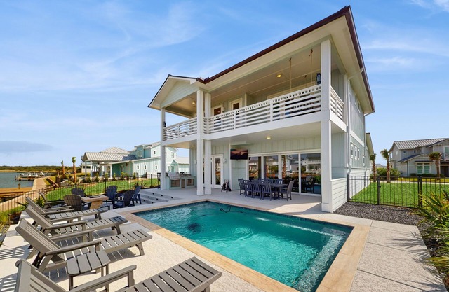 Stunning canal front home with private pool, fire pit, and boat dock