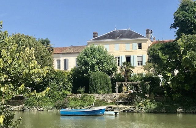 Stunning french townhouse with river frontage and private pool.