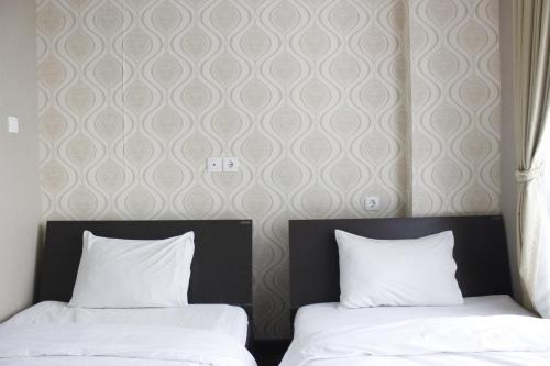 Stylish 1BR near ITB University at Dago Suites Apartment By Travelio