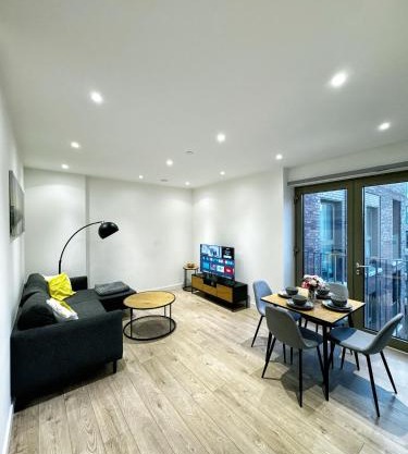Stylish 2BR Apartment with Balcony & Views