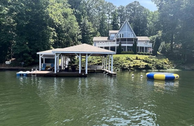 Stylish & Fresh Gaston Lakefront Retreat – Water Trampoline, Hot Tub, Family Fun
