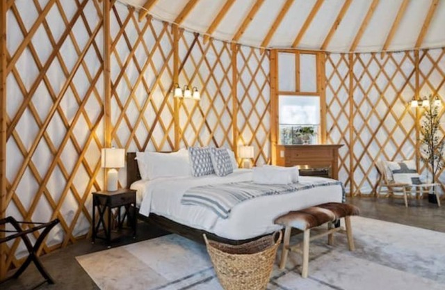 Stylish yurt with luxurious king bed.