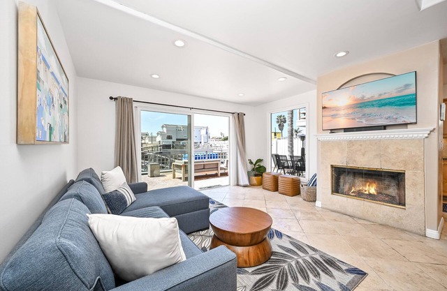 Sunset Island Waterfront Home with Kayaks across the Street from the Beach