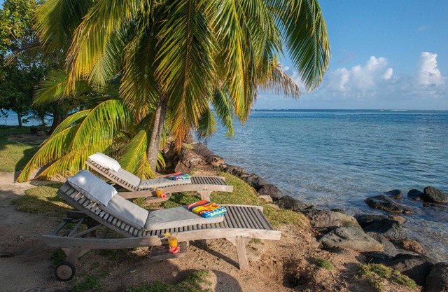Tahiti beach house, beachfront wooden villa on tilts, under trade winds, Moorea
