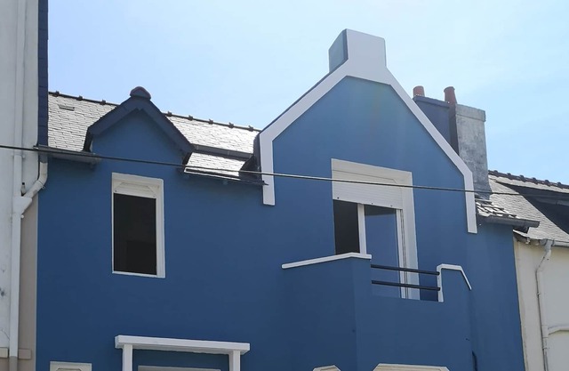 The blue house near the sea