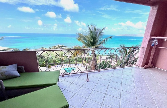 This 2 BR, 2 BA condo w/ breathtaking panoramic views of the Caribbean.