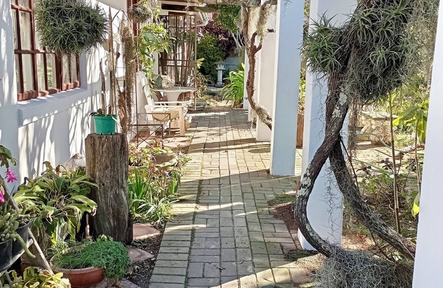 This cozy home is nestled in a beautiful secret garden.