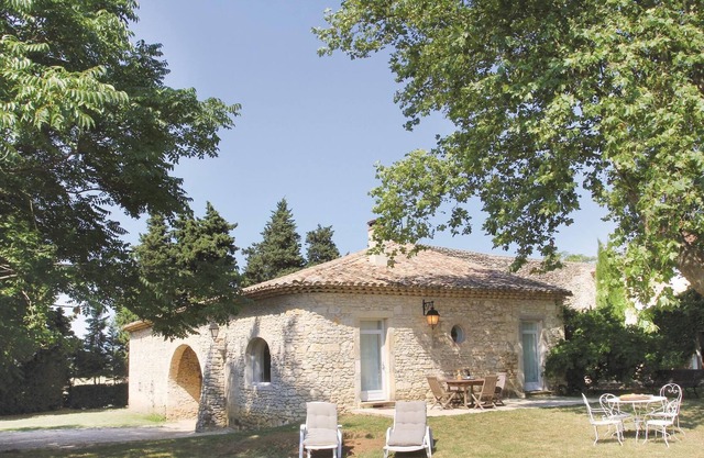 This delightful vacation property, adjacent to a large traditional country house, is situated on a g