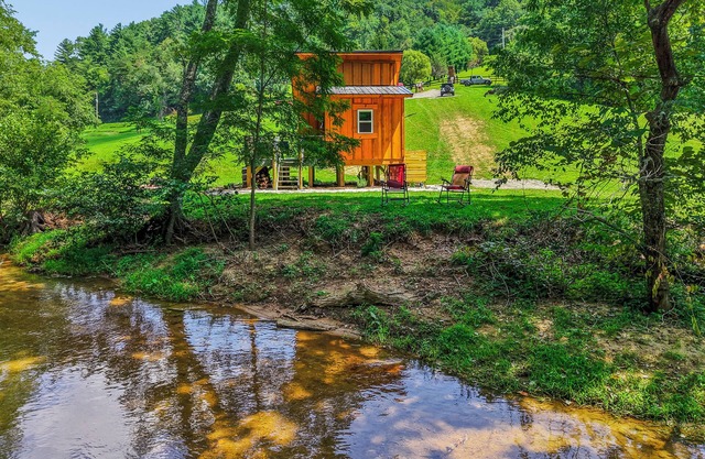 Tiny cabin sits by the bubbling, stocked creek.