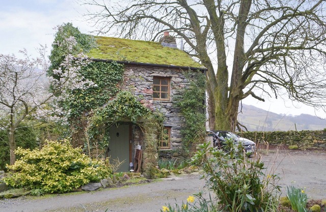 Unique cottage with a cosy living room set around an Inglenook fireplace.