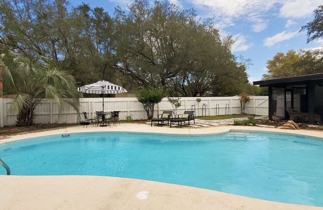 Updated dog-friendly home with private outdoor pool, patio, fireplace, W/D, AC