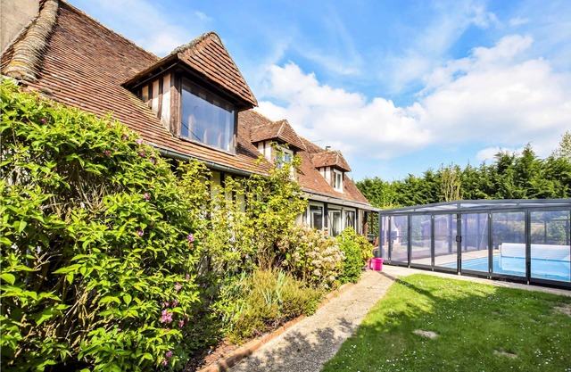 Very nice Norman half-timbered house with covered heated pool and indoor Jacuzzi.