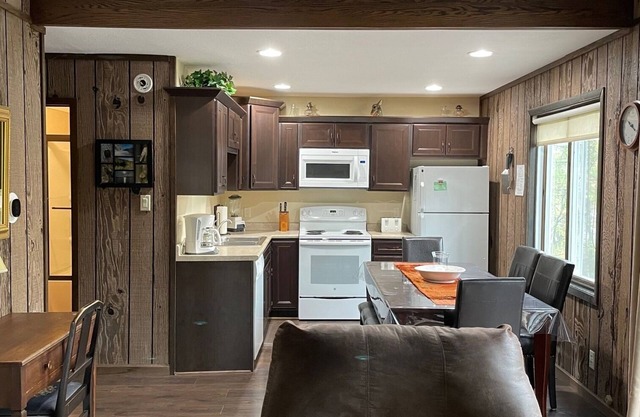 View the water from our huge NEW DECK and fully updated cabin in the woods