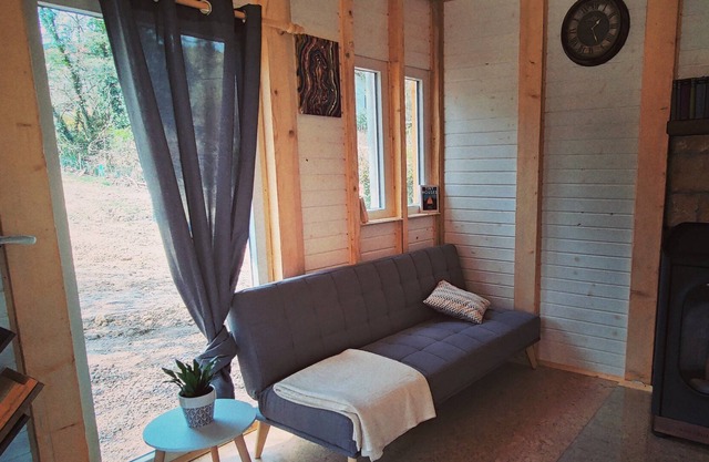 Wooden cottage between forest and wine