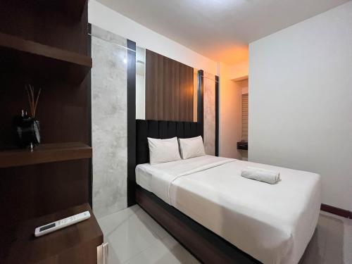 Warm and Cozy 2BR Vida View Makassar Apartment By Travelio