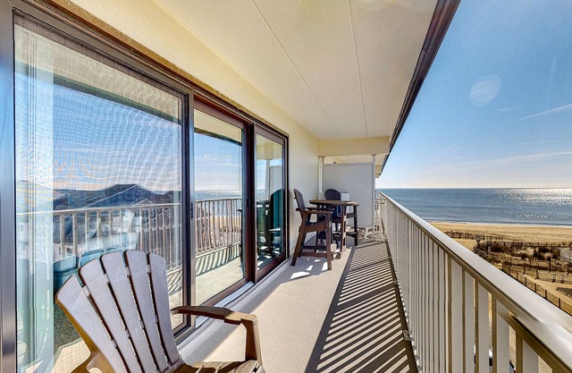 Water view condo with beach and pool access - balcony, W/D, and central AC