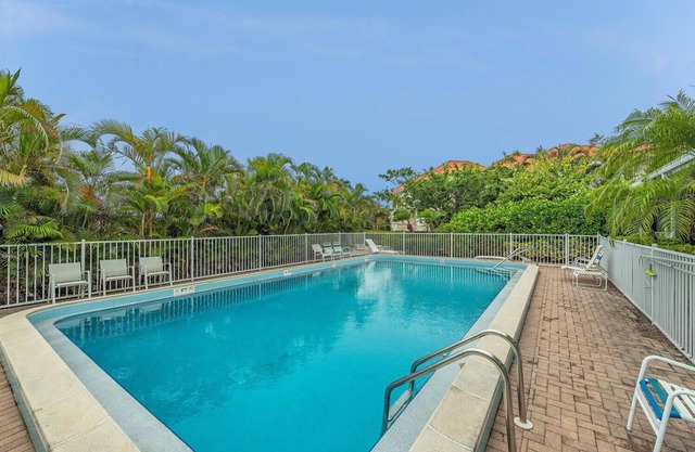 Waterfront condo with New heated pool and a dock.